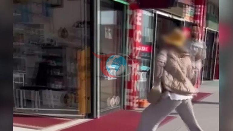 Kayseride bir kadın, eczaneye taşla saldırdı