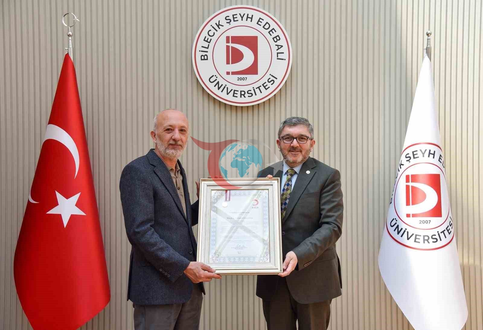 BŞEÜ&rsquo;ye gümüş madalya ve madalya beratı takdimi