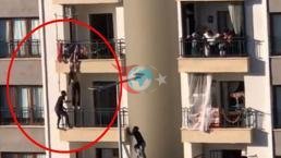 Balkondan düşmek üzere olan çocuğu balkondan tırmanarak kurtardı
