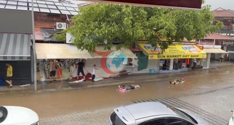 Astonishing image after the downpour in Fethiye Tourists swam with inflatable beds in flood waters