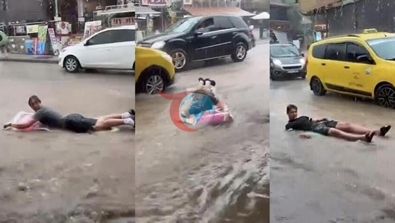 Fethiyedə leysan sonrası heyrətamiz görüntü Turistlər sel sularında şişmə çarpayılarla üzüblər